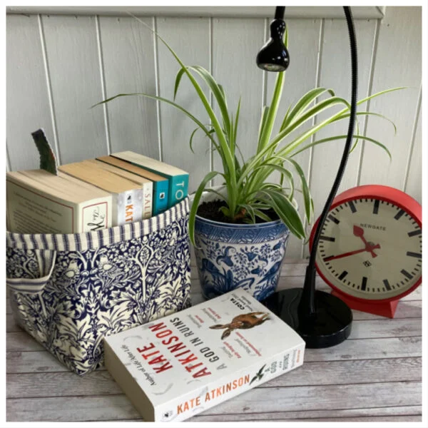 storage baskets books and clock