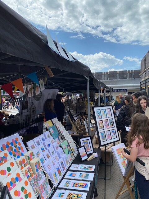 image of stallholder selling at sale makers market