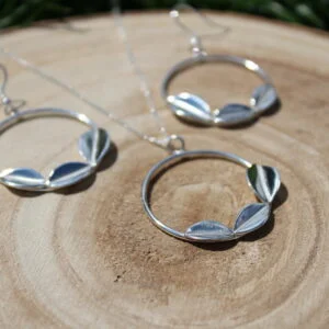 Wood slice with sterling silver drop hoop earrings and hoop necklace. Each item of jewellery features three leaves.