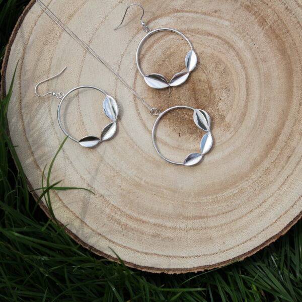 Wood slice with sterling silver drop hoop earrings and hoop necklace. Each item of jewellery features three leaves.