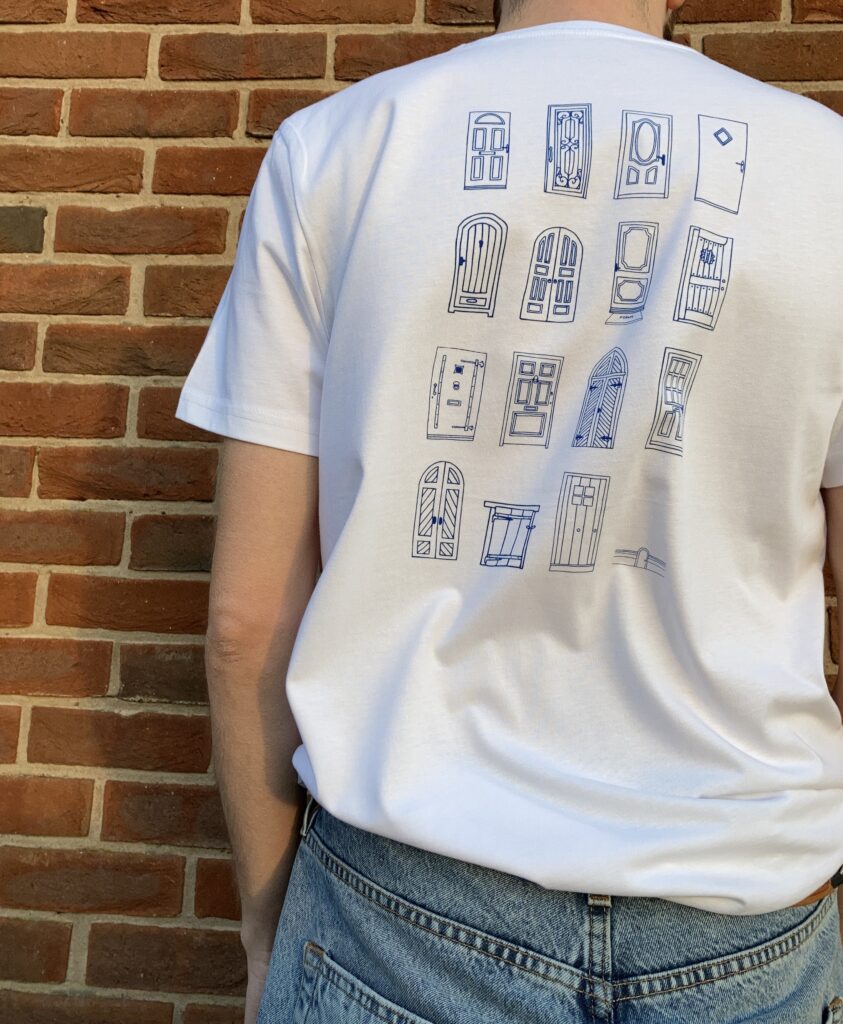 White t-shirt with multiple hand drawn doors