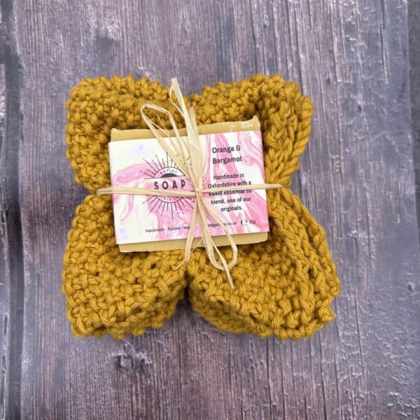 A soap and wash cloth bundled together with raffia