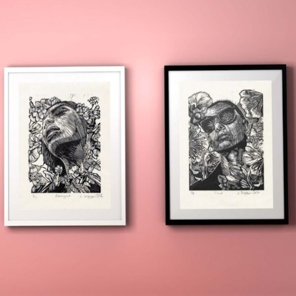 Monochrome figurative linocut print artwork. portraits in nature Diptych on pink wall. black frames