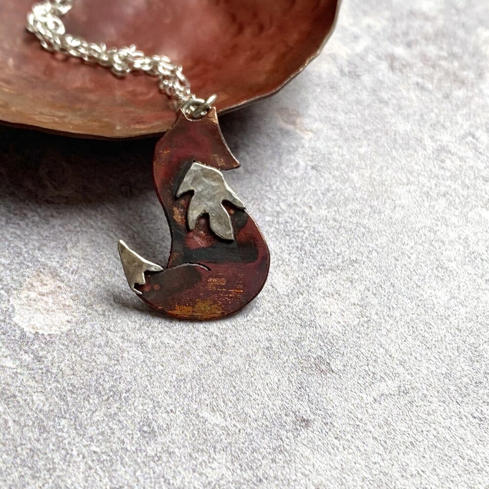Copper fox with silver bib and tail tip