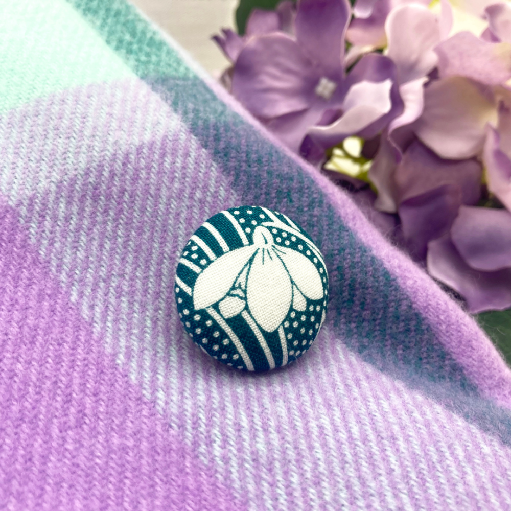 teal snowdrop fabric button brooch on scarf by Bowerbird Jewellery, snowdrop jewellery