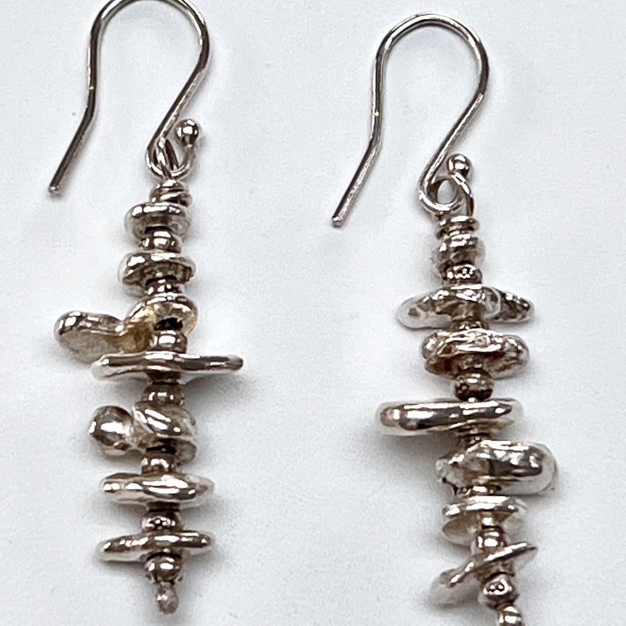 These unusual Organic Drop Earrings are made from little solid drops of fine silver, all uneven and random shapes and sizes. They compliment many of my other organic pieces and look stunning when worn with the nugget pendants or rings, or my new collection of organic erosion rings. They remind me of the beauty and unpredictability of our natural world. Nicole Jansen Jewellery