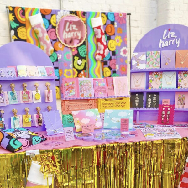 Liz harry stall - lots of gold streamers and pinks and purple
