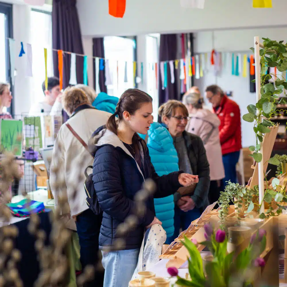 Shoppers browsing handmade ceramics, plants and gifts at a busy Paper Daisy Events makers fair in Shoreham.