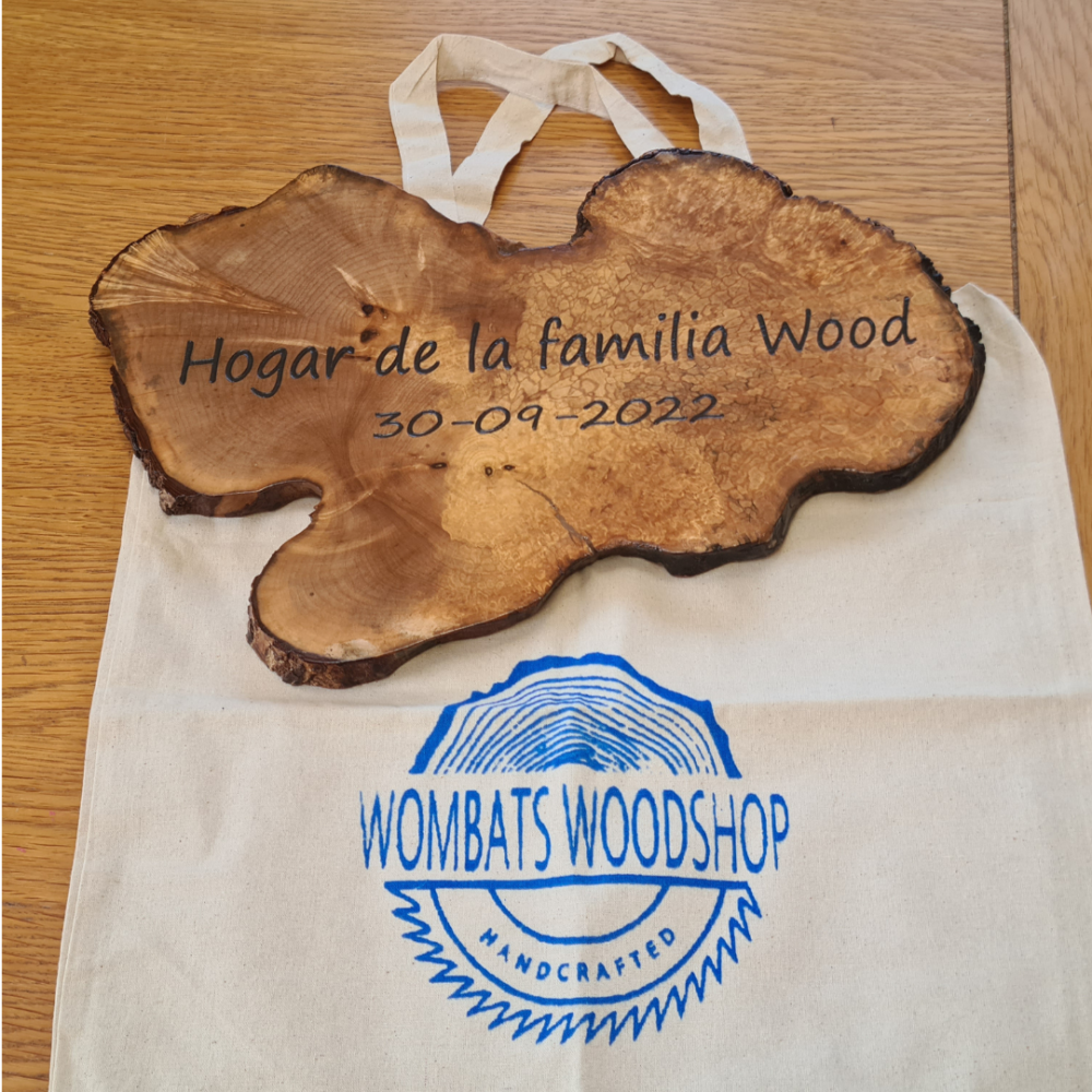Wombats Woodshop wood slice hanging sign with family name and dates