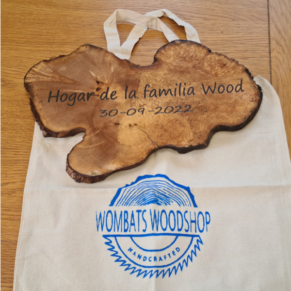 Wombats Woodshop wood slice hanging sign with family name and dates