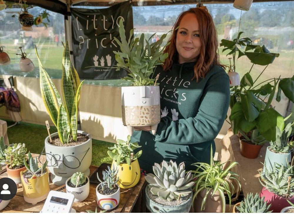 Little pricks stall - Emma Founder holding a cute face planter