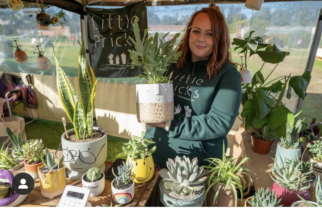 Little pricks stall - Emma Founder holding a cute face planter