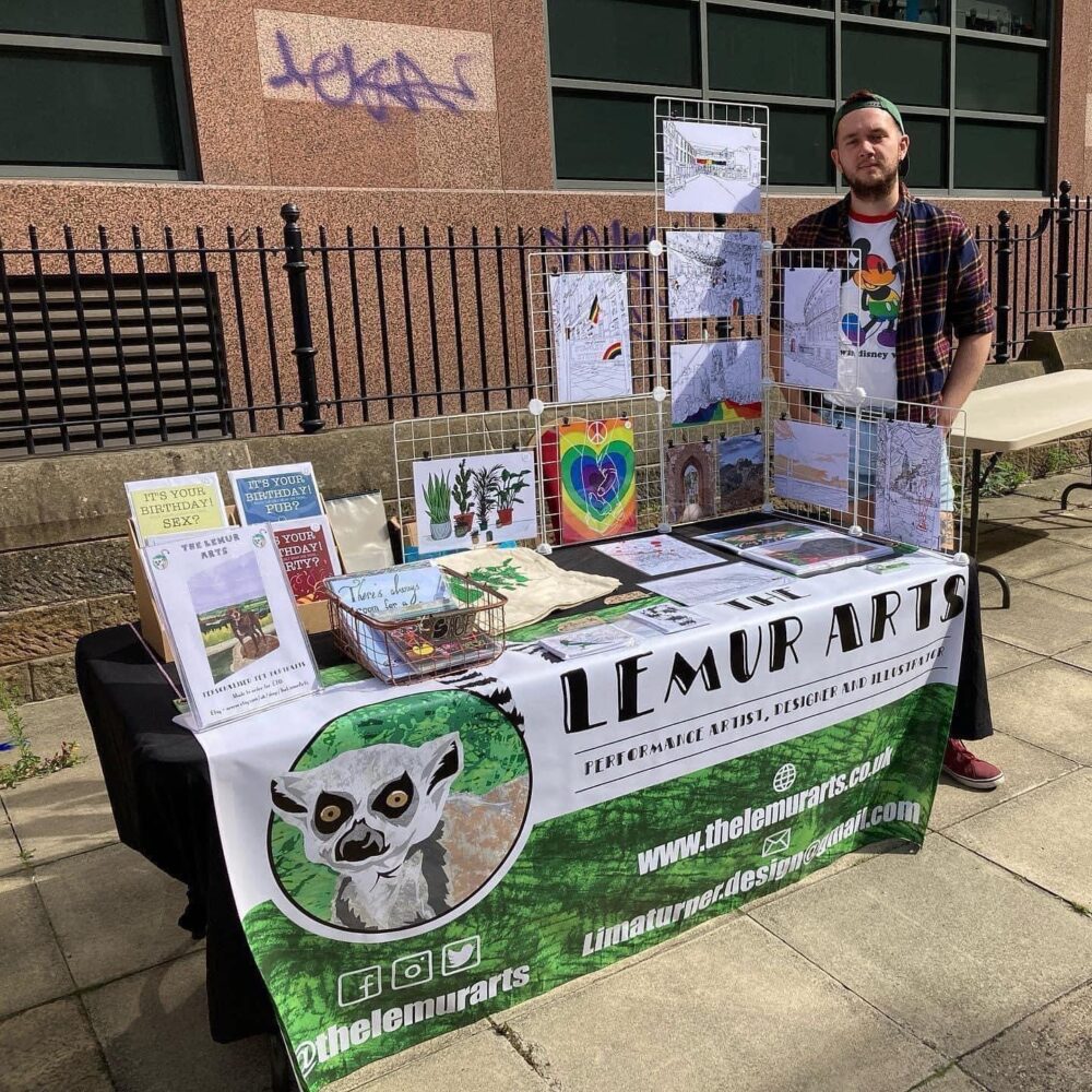 A picture of myself and the lemur arts stall in Leeds.