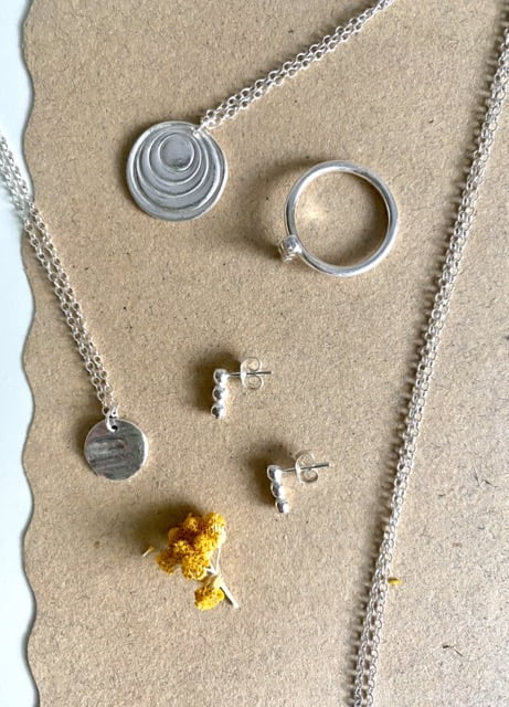 Achillea Jewellery, round necklace pendants and stud earrings in silv
