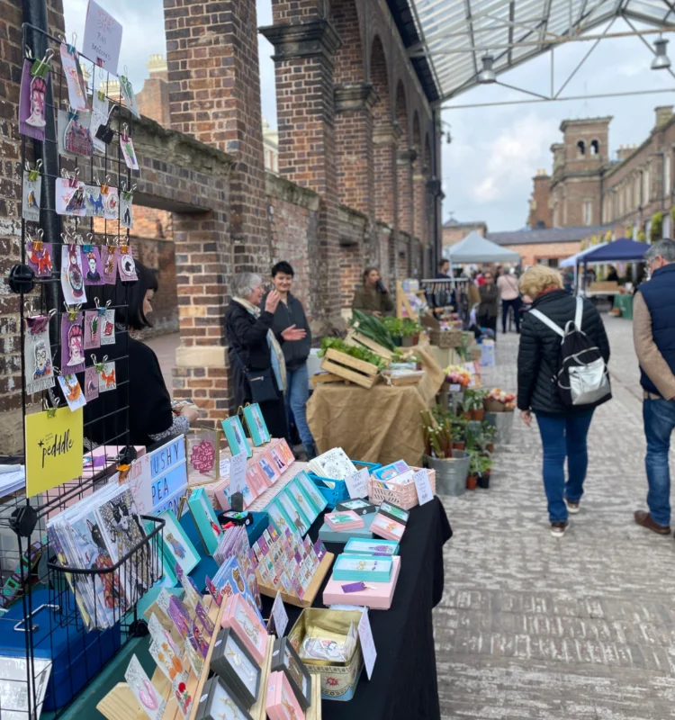 Market, stalls & customers at Pedddle - web banner