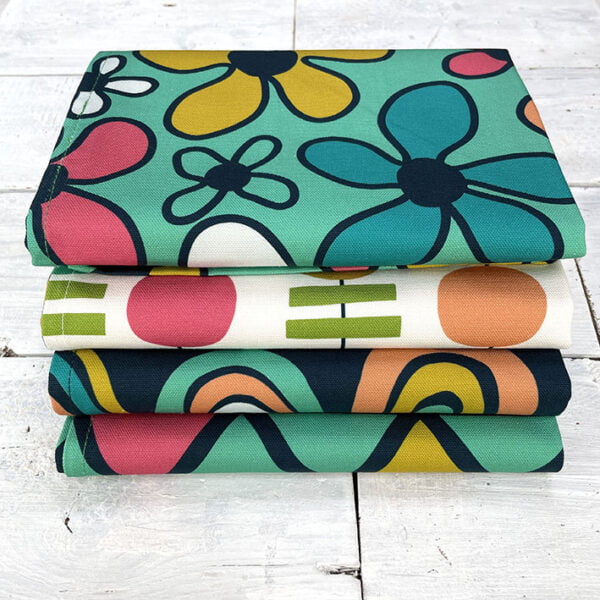 A stack of colourful patterned tea towels