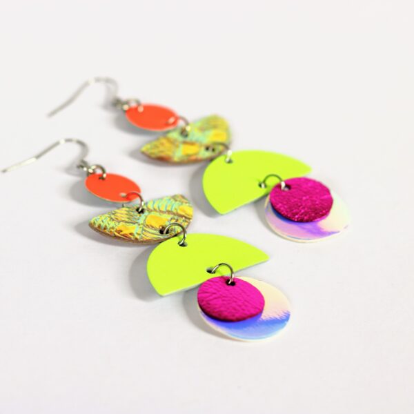 large dangly earrings with circles and semi-circles in neon and holographic