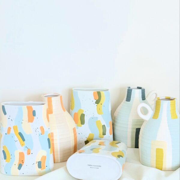 Handpainted vases by Tasha Samasuwo on a table