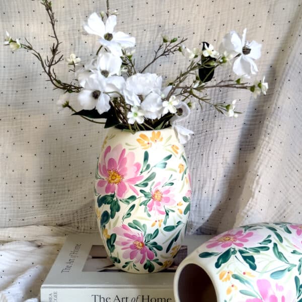 Large ceramic vase with pettily flowers painted on it