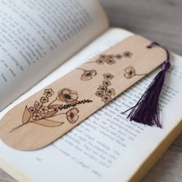 wooden pyrography bookmark displayed on an open book