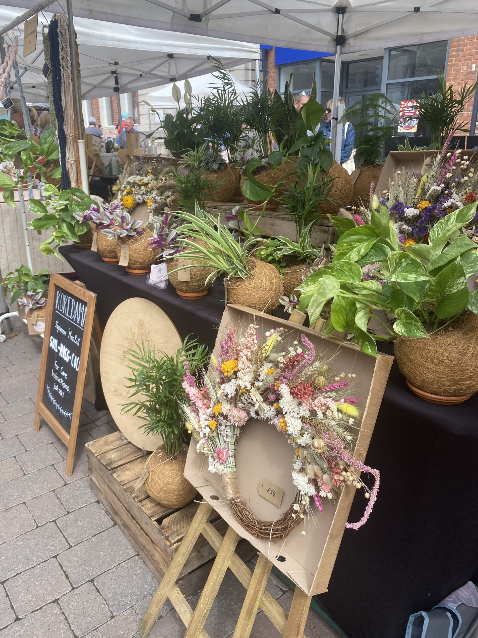 Can you make money at craft fairs? Image of a beautiful dried flower and plant stall