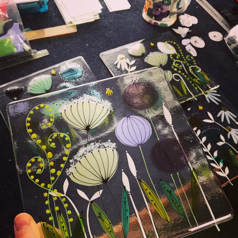A photo of one of Sarah's large floral glass panels which shows her work in progress.