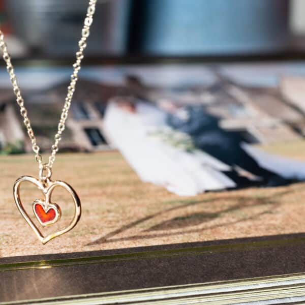 bronze heart with enamel detail. Eyres Jwellery