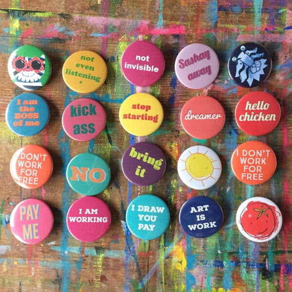 rows of round badges with words and images printed on them