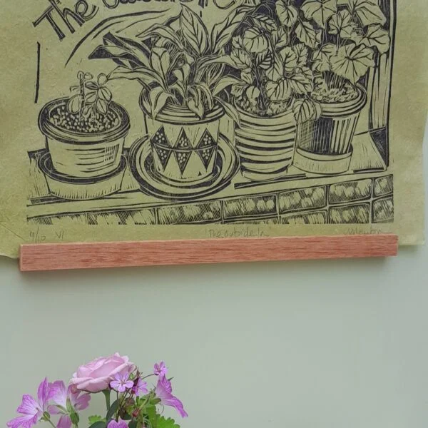 Mandy Benton Printmaker 'The Outside In' linocut print featuring an array of indoor plants printed in black ink onto beautiful lime coloured handmade paper.