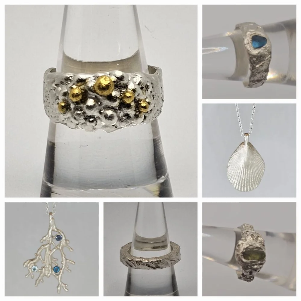A collage showing six handcrafted treasures created by Smith and Xarver Jewellery. These include a hand carved sterling silver chunky wave band, a seafoam textured sterling silver ring with gilded 24ct bubbles, a fine silver shell pendant, a fine silver seaweed necklace set with a cornflower blue sapphire, a London blue topaz and an aquamarine.
