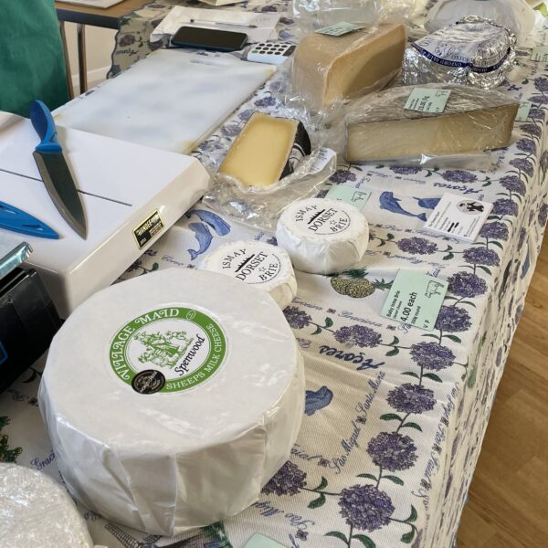 Delicisou array of local cheeses displayed by the cheese agent at Highclere independent market