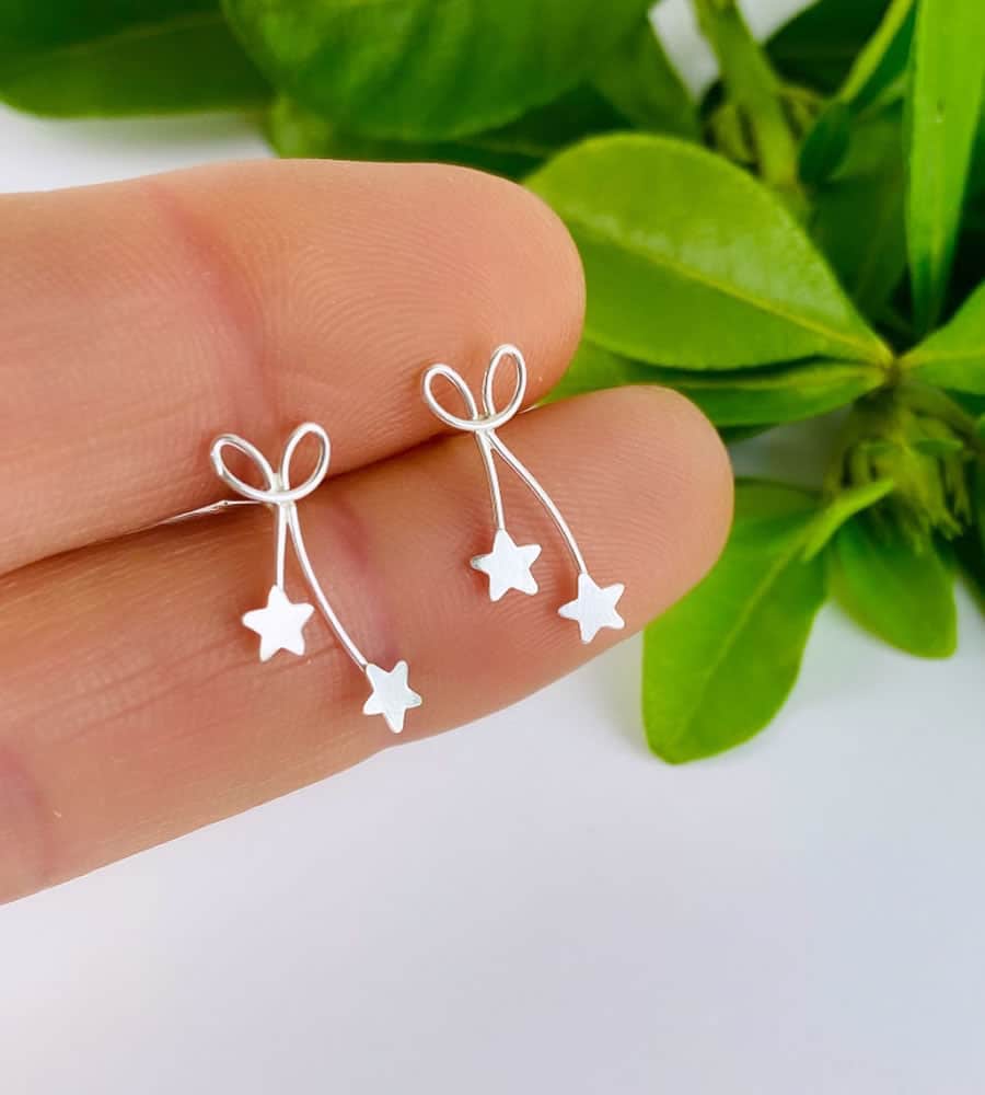Sterling silver bow and star earrings