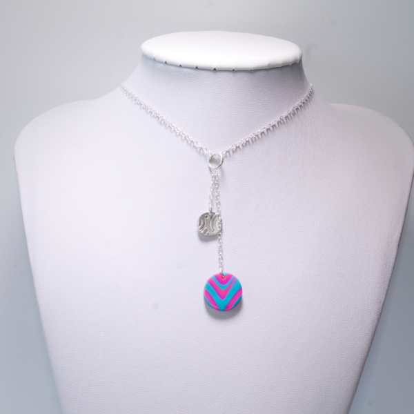 Abby's Art Atelier- Polymer Clay and Fine Silver Necklace on a Sterling Silver Chain. Fine Silver ins Embossed with a Swirly Pattern.