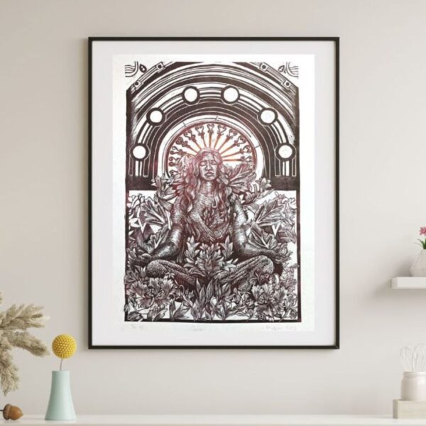 Large linocut artwork titled gaia, featuring a female sitting cross legged surrounded by plants and flowers