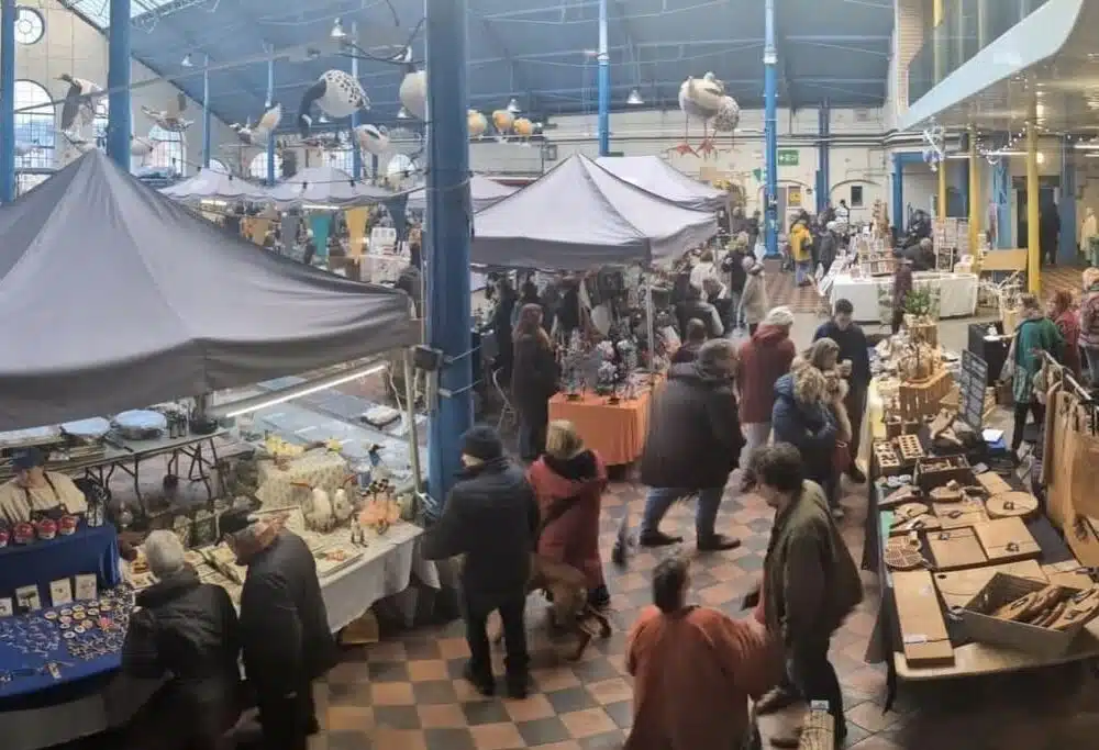 Image shows a market hall full of makers stands
