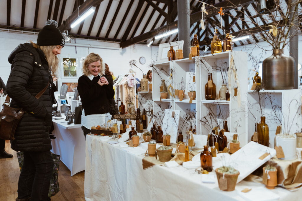 Beautiful stall with stallholder at Farnham Maltings Monthly Market
