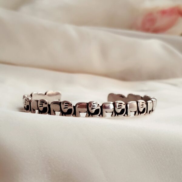 Elephant Bangle featuring patterned Elephants in a row in sterling silver; open bangle bracelets