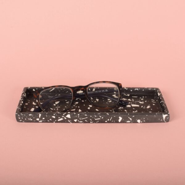 A black and white rectangular terrazzo tray holding a pair of glasses - Ilex Studios Co. / Ilex Home