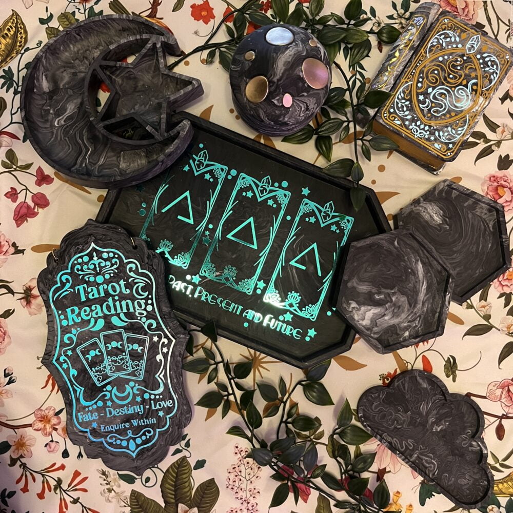 A photo containing dark grey coasters, a moon & star shaped tray, a cloud tray, a mushroom jar and 2 book shaped jewellery boxes