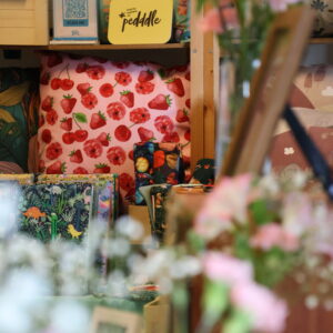 A cushion with a fruit design on Sazzi Creations stall at Tissington Craft Fair in Derbyshire, Tissington Craft Fairs