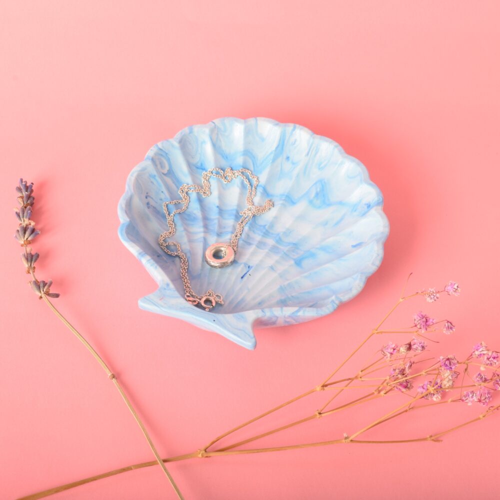 A blue and white shell trinket dish with a necklace in it - Ilex Studios Co. / Ilex Home