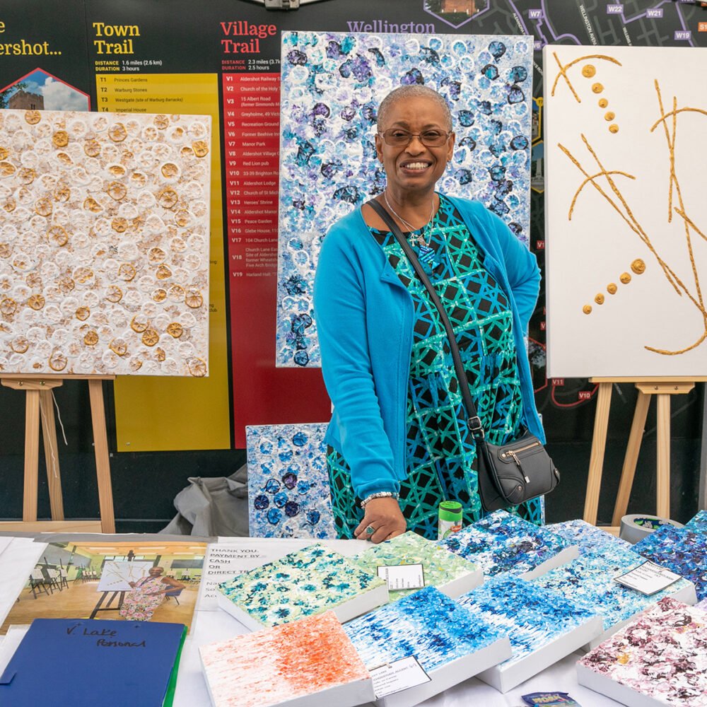 Aldershot Craft Fayre. Colourful female woman stallholder ar Aldershot Craft Fayre colour stall
