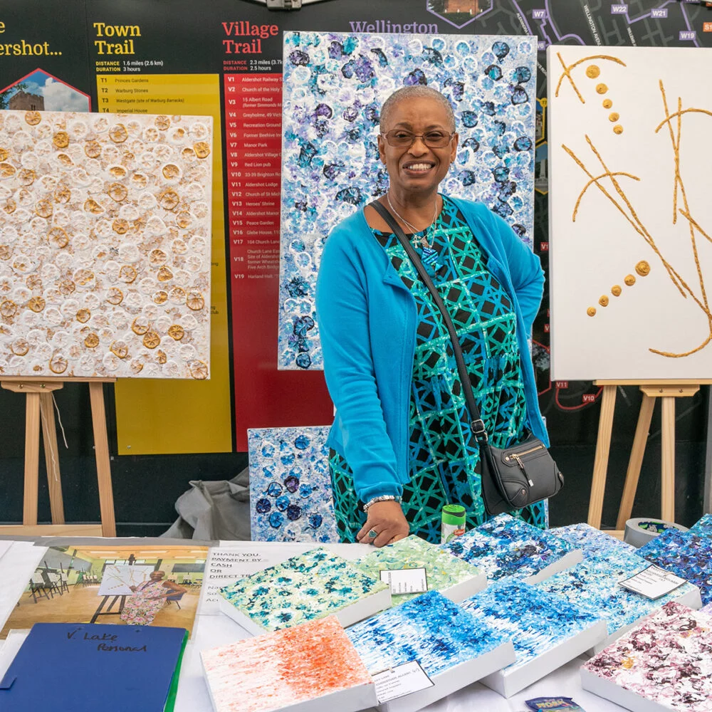 Aldershot Craft Fayre. Colourful female woman stallholder ar Aldershot Craft Fayre colour stall