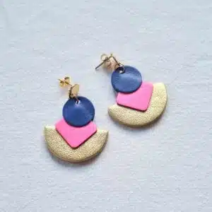 gold semi circle earrings with pink diamond shapes and blue circles