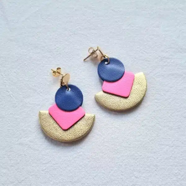 gold semi circle earrings with pink diamond shapes and blue circles