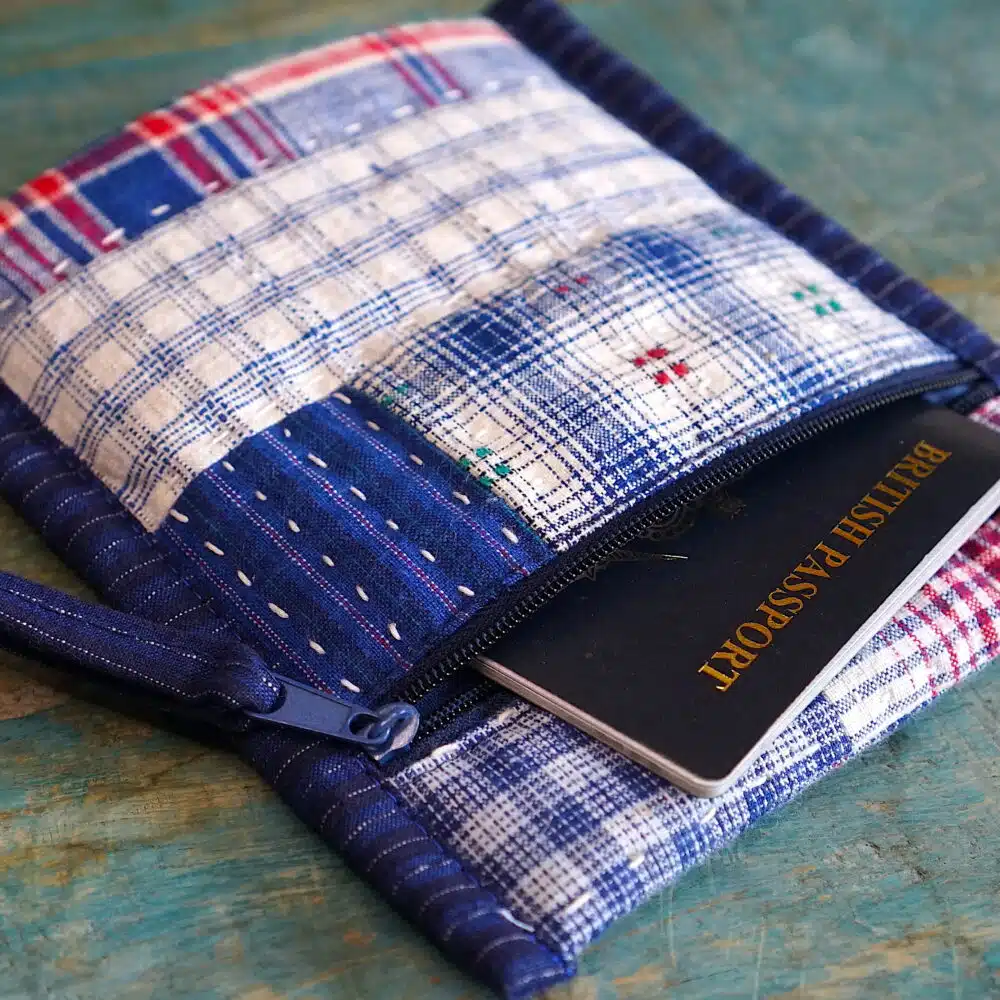 Patchwork fabric pouch holding a passport