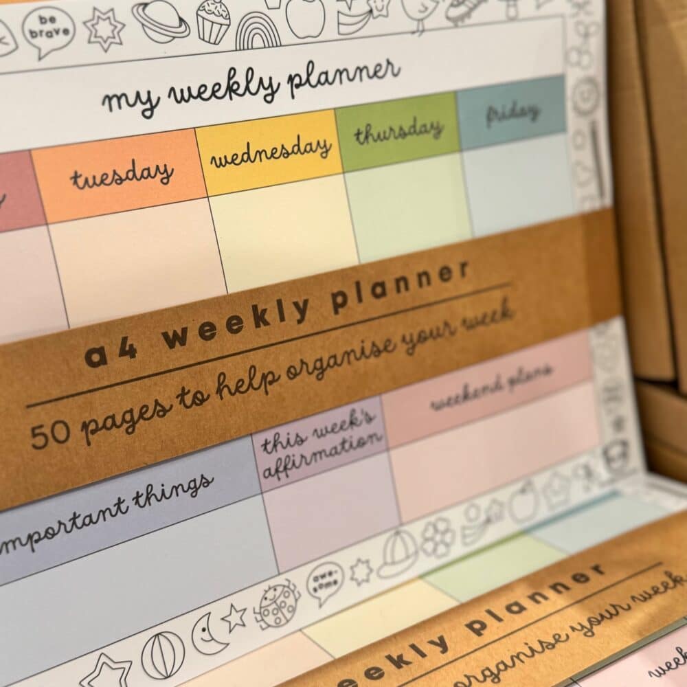 A weekly planner for children with pastel colours and little fun doodles to colour around the edges