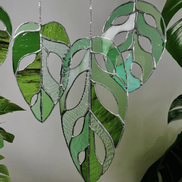 Hand crafted hanging glass Monstera plant leaves available at the next Wylde Thistle market