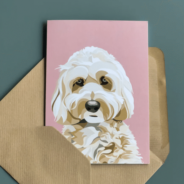 A greetings card featuring a cute with Cavapoo dog on a pastel pink background available at the next Wylde Thistle market