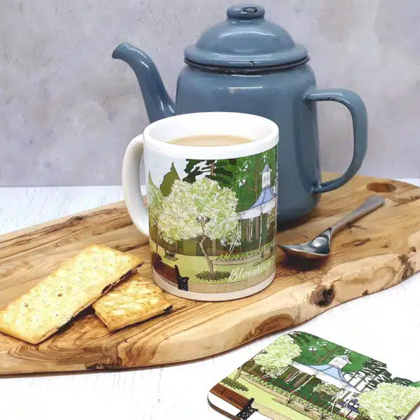 A lifestyle photo of a Blooming Swindon Ceramic Mug and Coaster by dona B drawings